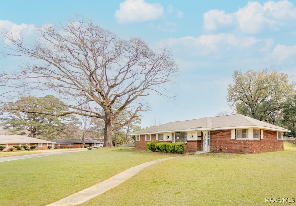 NESTLED NEAR TALL TREES THIS ONE LEVEL HOME SITS O