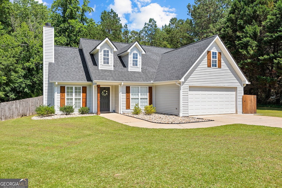 Beautifully updated home with new siding, gutters, landscaping, and shutters!