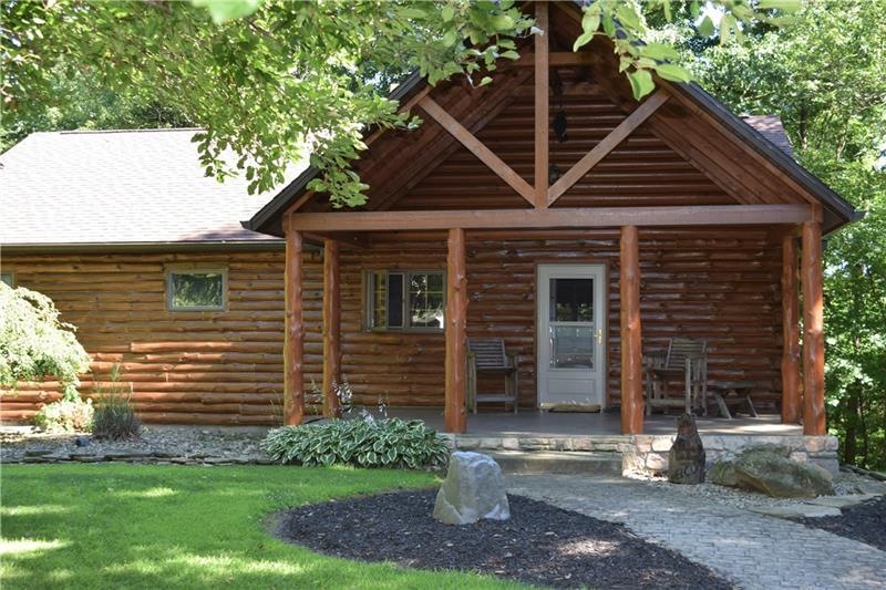 Log home is nestled in 22.5 acres of tranquility.