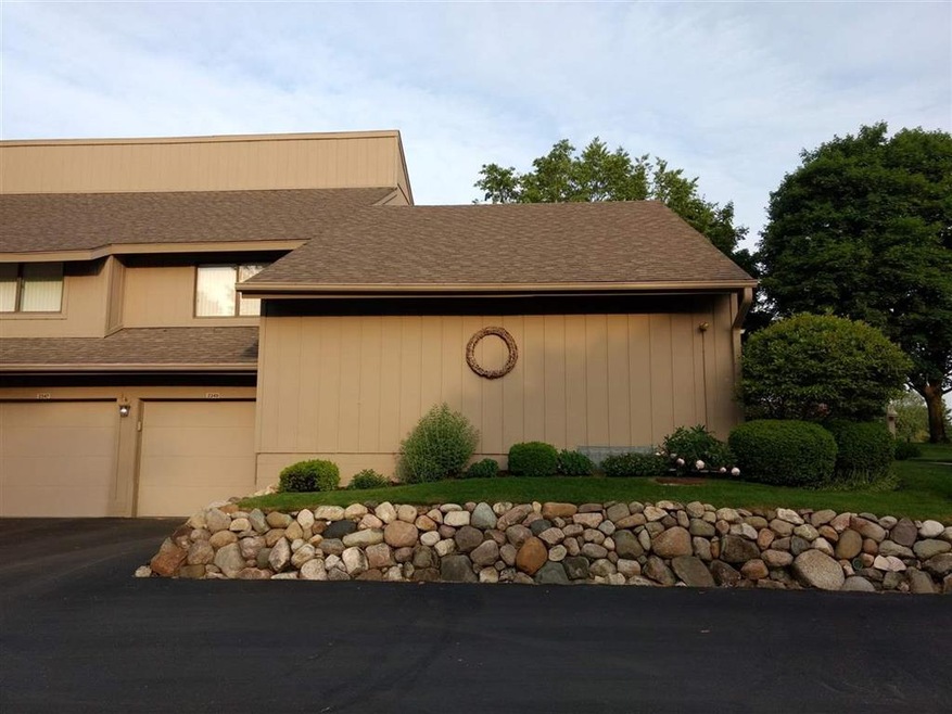 One Story condo sets of beautifully landscaped grounds!