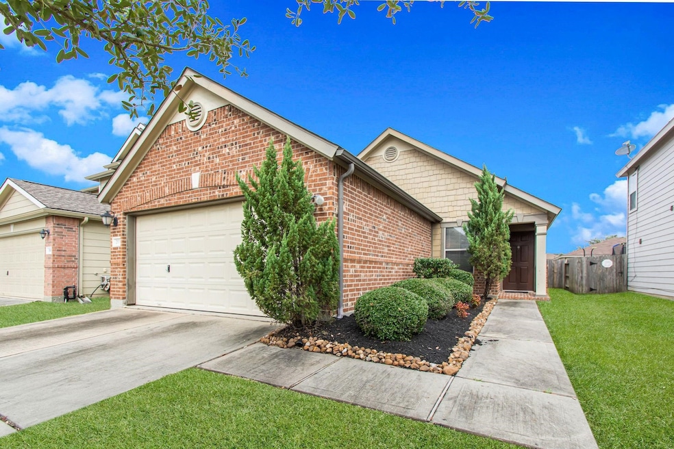 Charming single-story brick home with a two-car ga