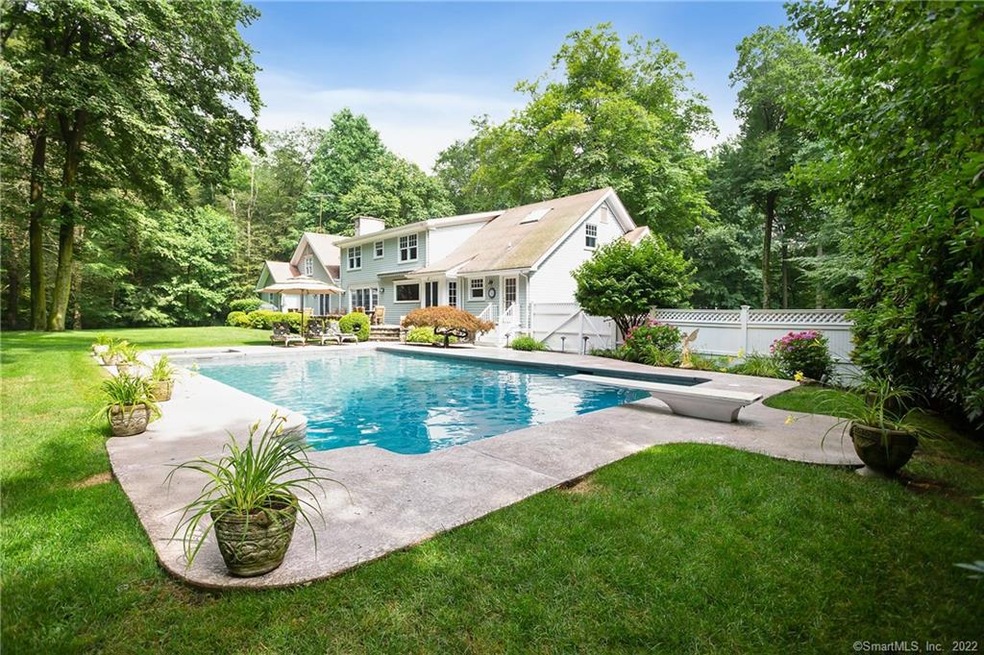 Large pool w/spa & back view and his/her cabanas b