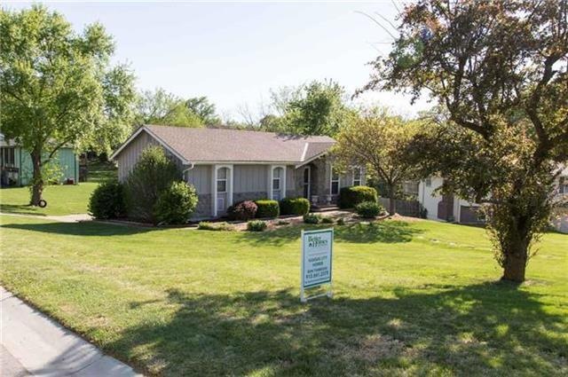 Front Elevation Located on Large Corner Lot at Top