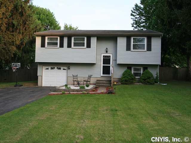 Exterior Front. Newer replacement windows and garage door. Double driveway.