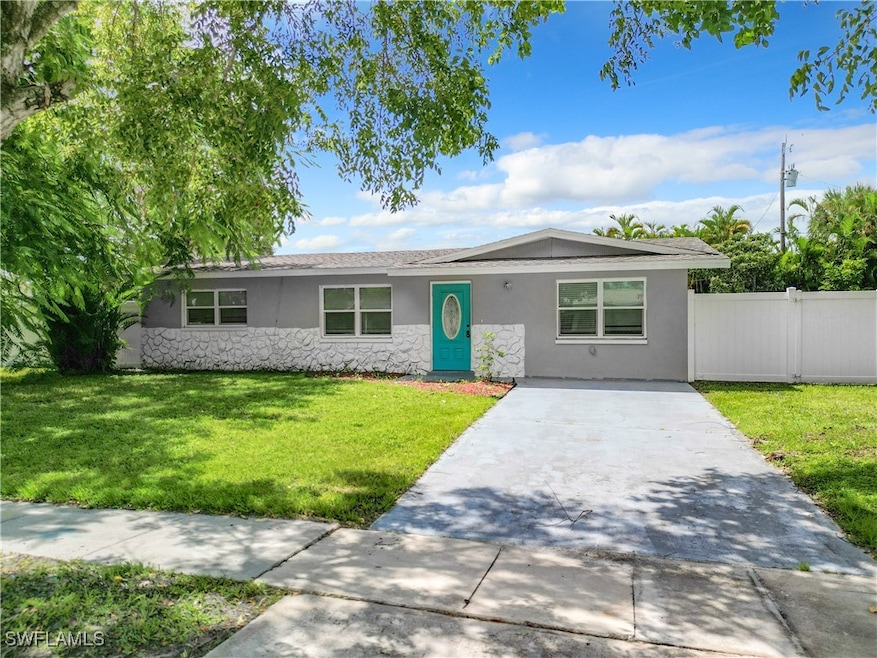 Ranch-style house featuring a front lawn