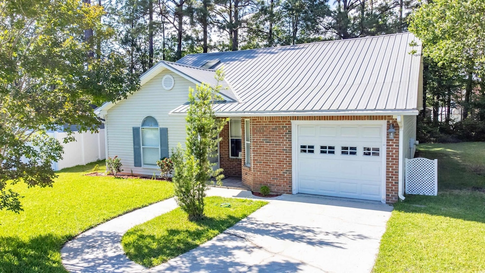Traditional home with an attached garage, brick si