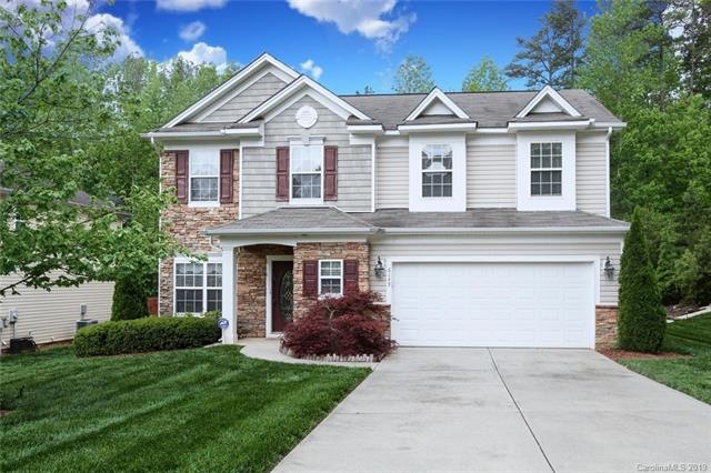 Lush low-maintenance landscaping welcomes you home on Brightstar Valley....