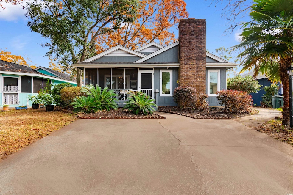 View of front of house with a sunroom