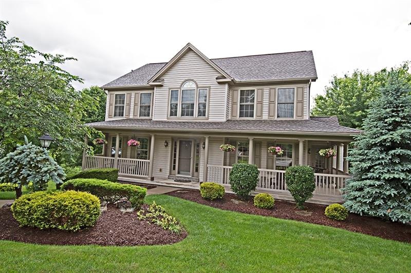 The wrap around front porch welcomes you into this