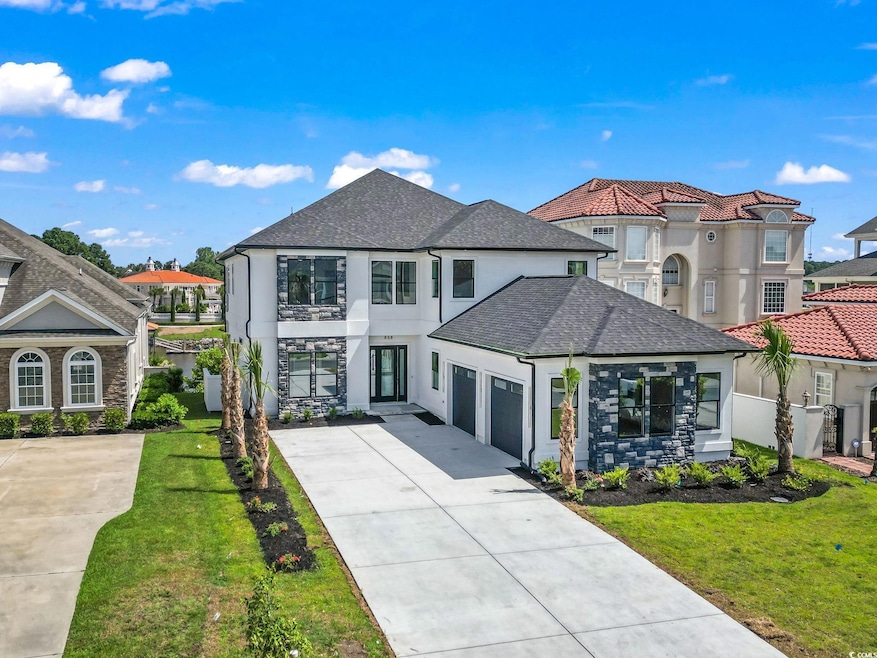 View of front of property featuring a garage and a