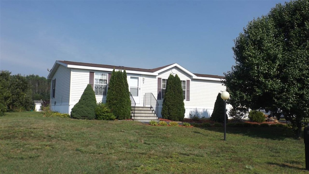 Nicely landscaped yard with paved walk