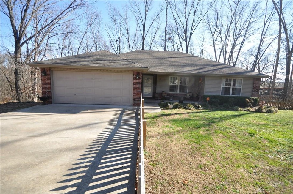 Nice front yard with picket fencing for safe access for your doggies