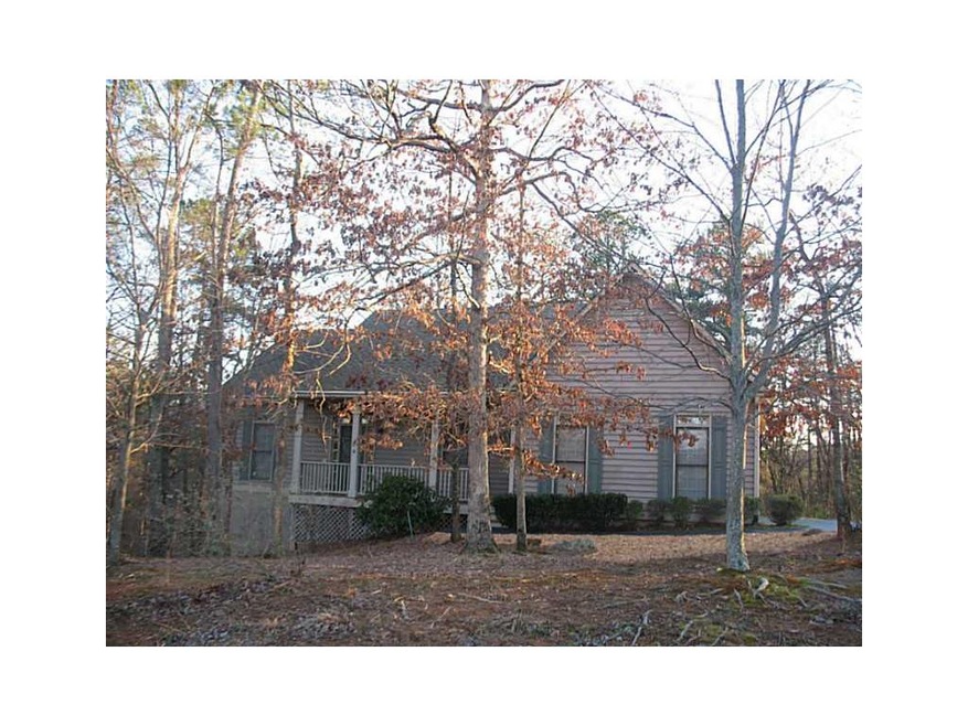 Exterior Front. Lovely wooded corner lot