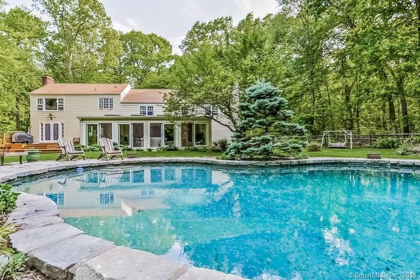 Breathtaking Pool Area and Back Exterior of House.
