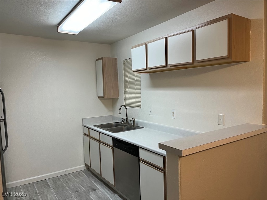 Kitchen featuring a sink, stainless steel dishwash