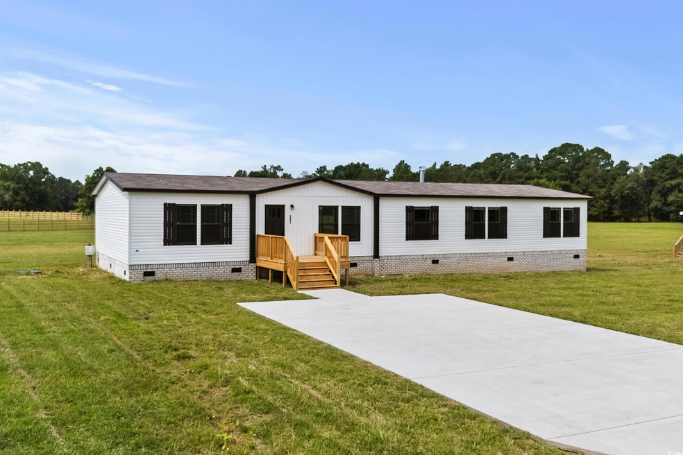 Manufactured / mobile home with a patio area and a