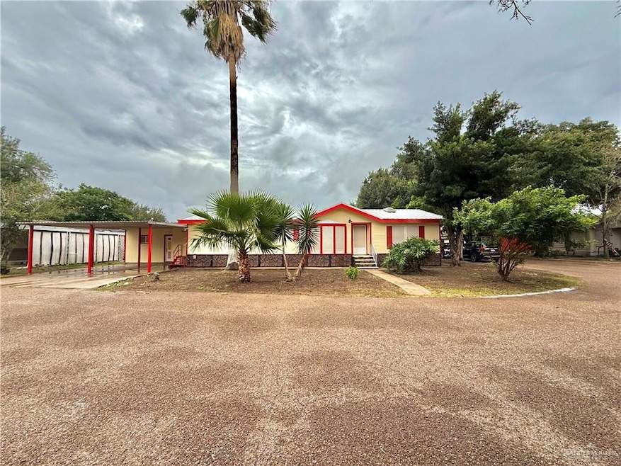 View of front of house with a carport