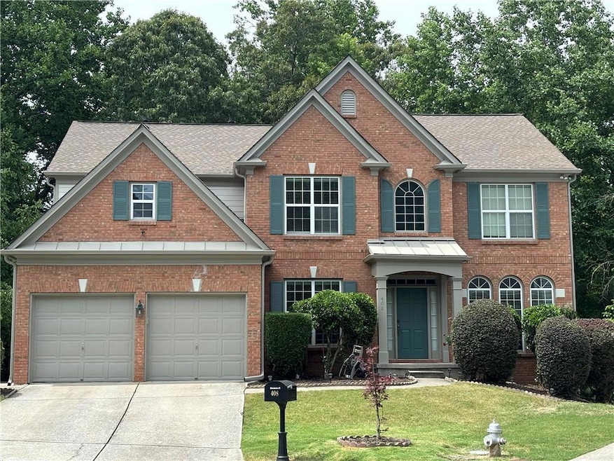 View of front of home featuring a garage and a fro