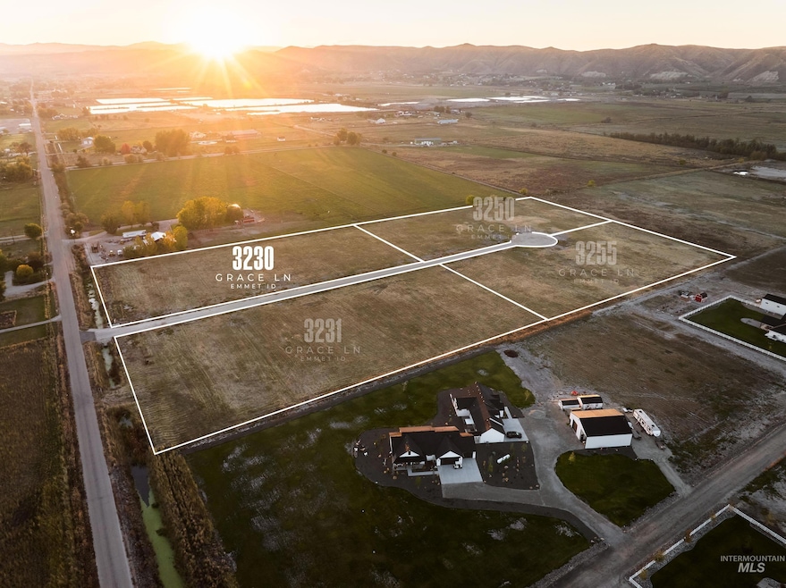 Aerial view at dusk of a mountain view, a rural view, and property parcel outlined