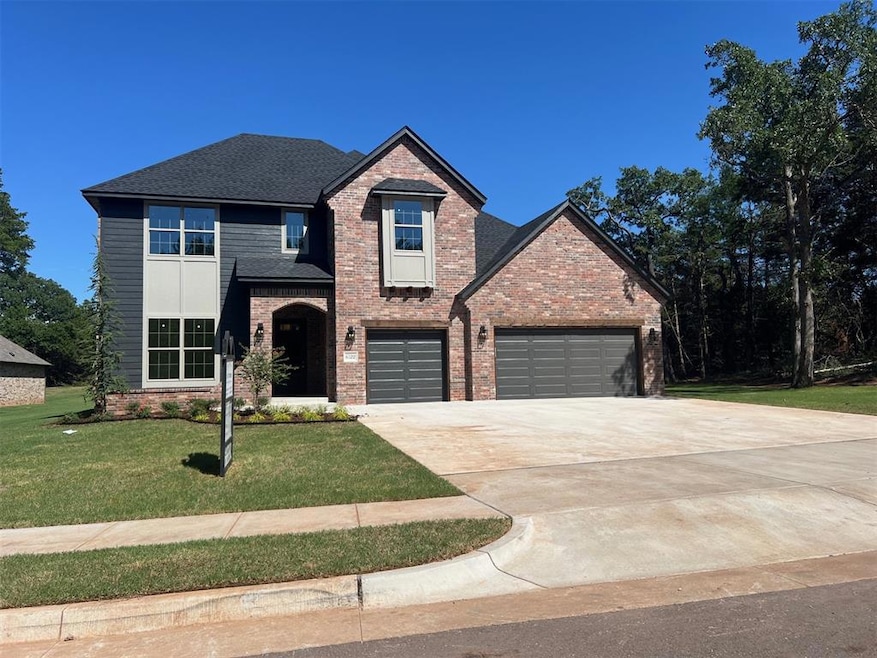 View of property featuring a front lawn