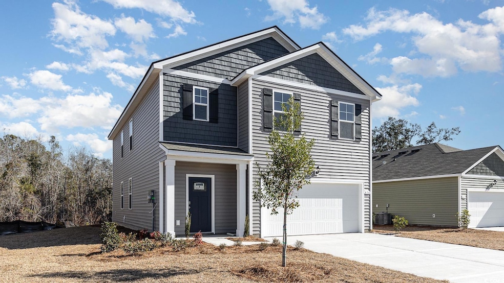 Craftsman inspired home featuring concrete drivewa