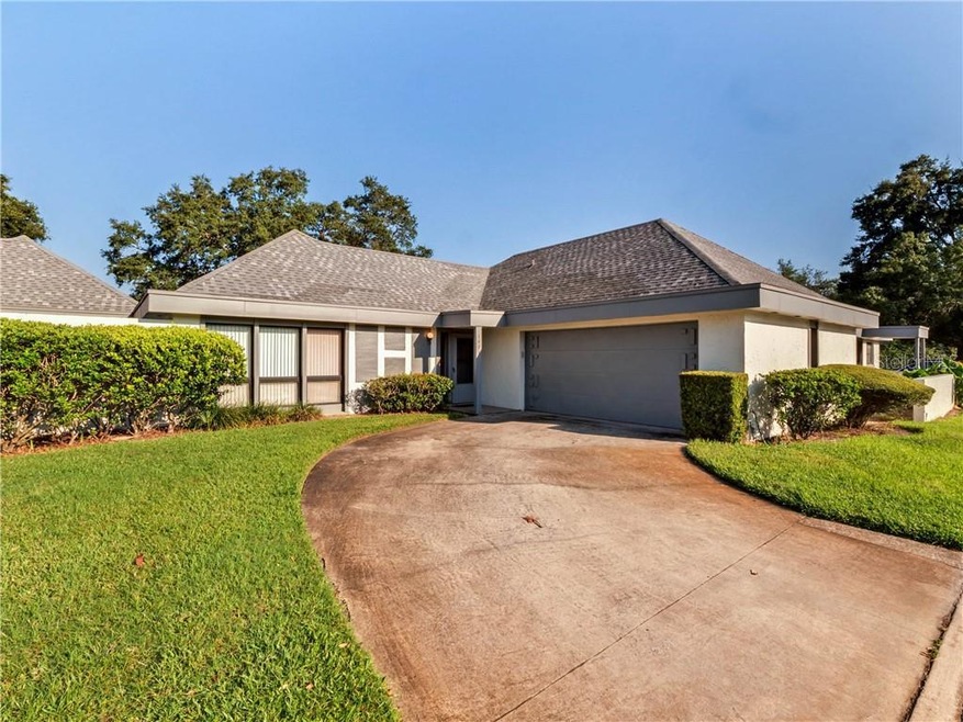 Front of the home with private driveway and garage