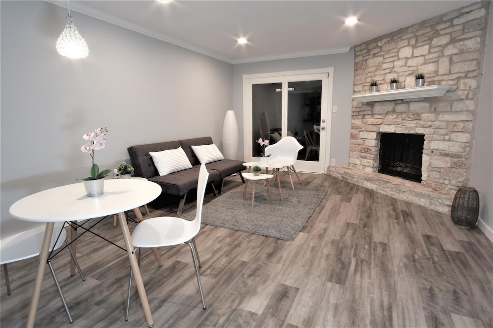 Living area with ornamental molding, wood finishe