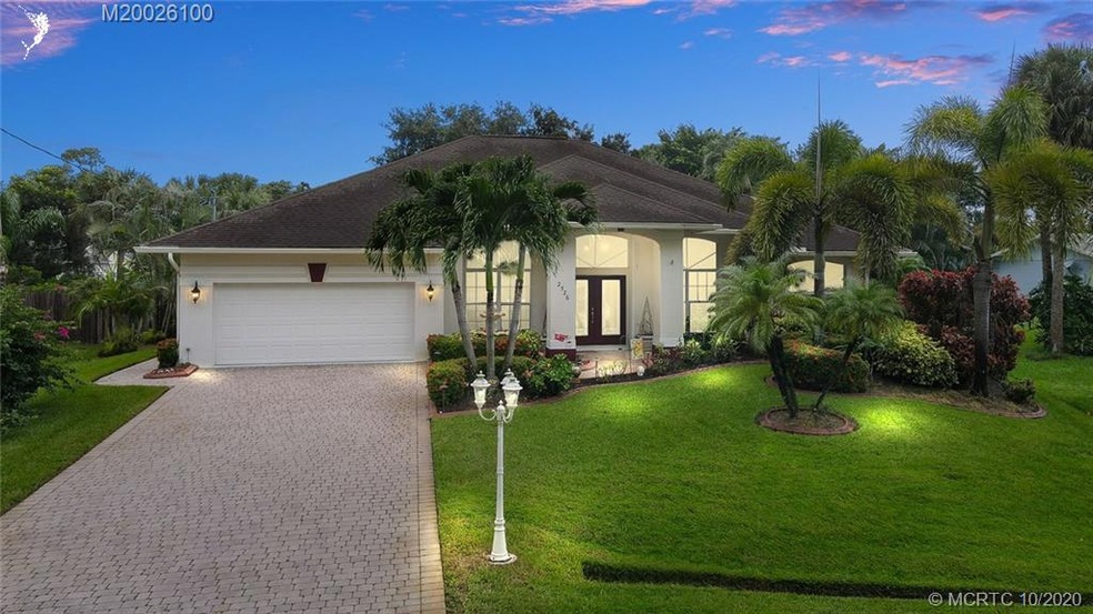 THE FRONT OF THE HOME, PAVER DRIVEWAY, DESIGNER CU