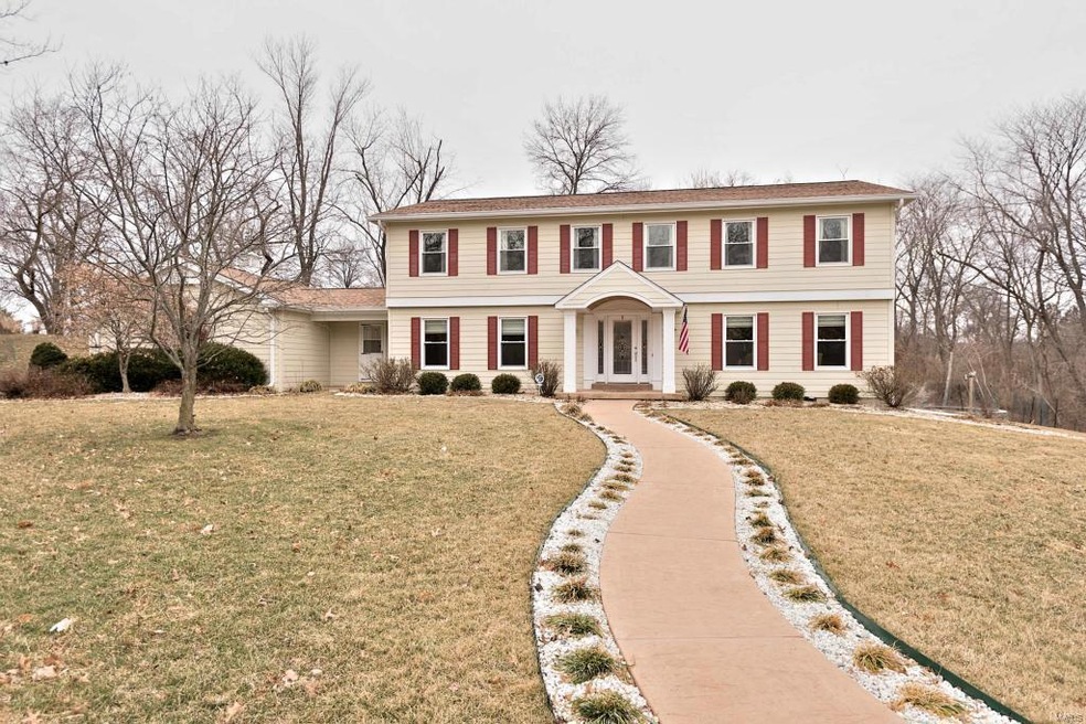 Welcomed by stamped concrete curved walkway