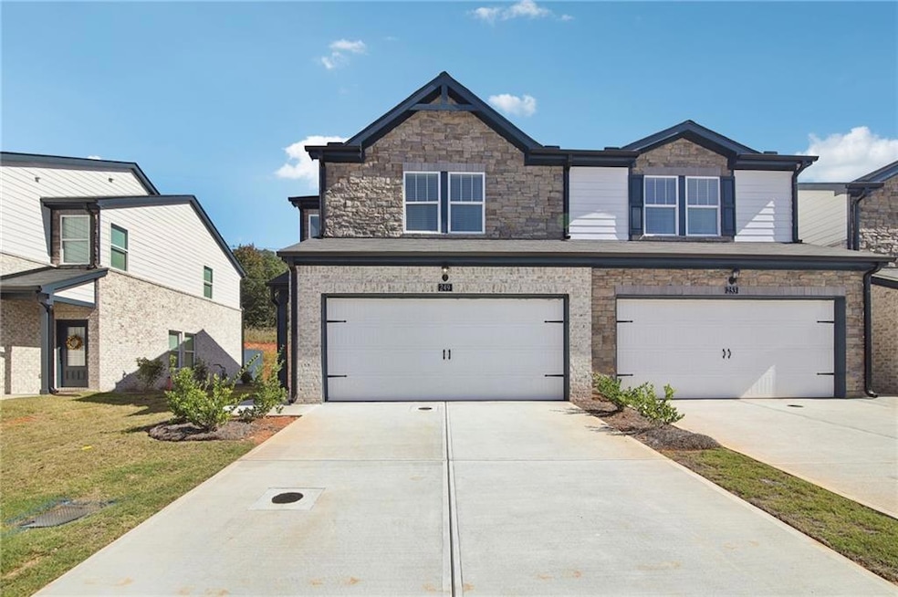 View of front of property featuring a garage and a