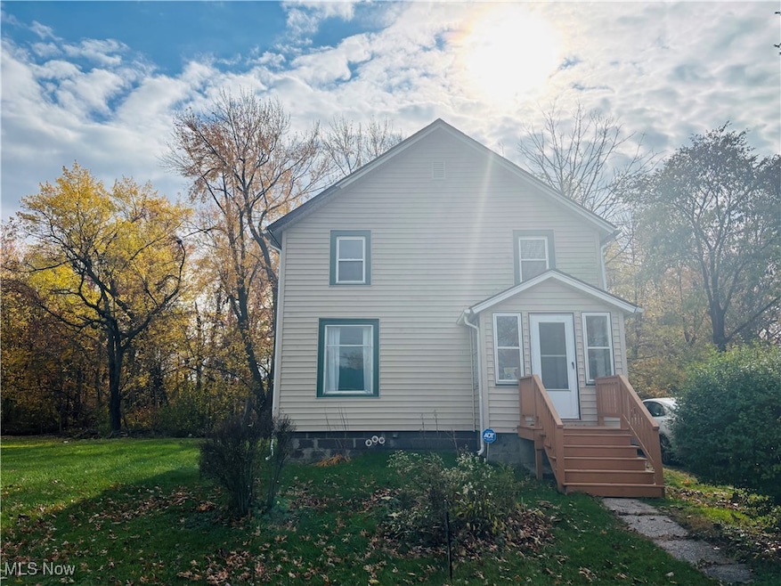 View of front of property with a front yard