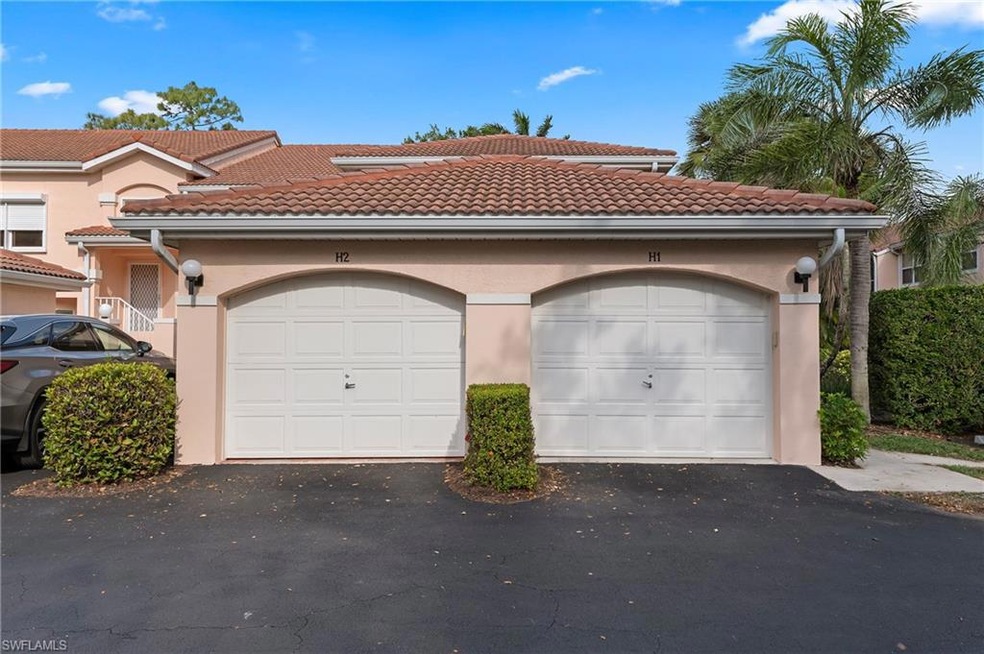View of front of property with asphalt driveway, s