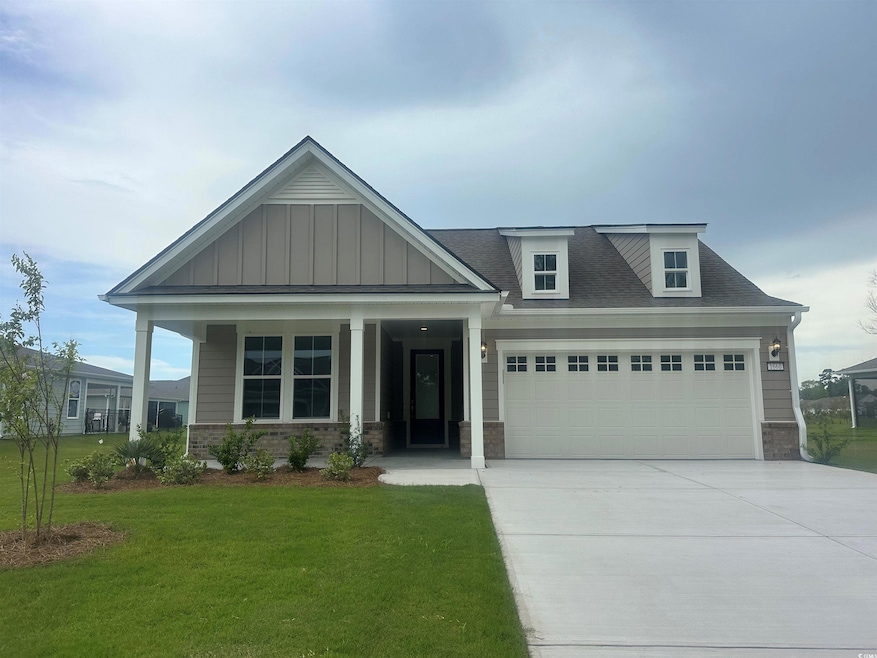 Craftsman-style house featuring a garage and a fro