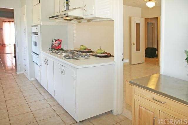 Kitchen with Breakfast Bar Open to Dining Room