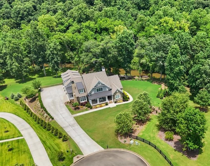Welcome home to 134 Sharp Mountain! This is more than an address—it's an exclusive paradise nestled on two private, park-like acres with stunning, accessible frontage on the serene Sharp Mountain Creek.