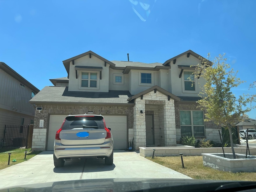 View of front of property with concrete driveway,