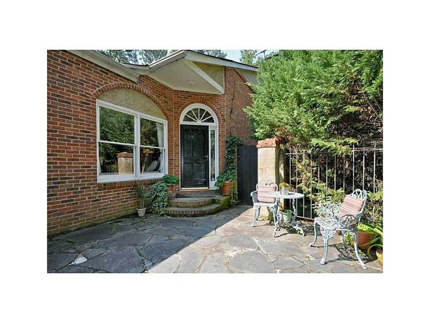 Exterior Front. An intown oasis minutes from the best that Atlanta has to offer. Terrace patio at entrance to this home.