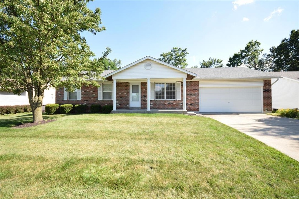 Front view of home and front lawn.