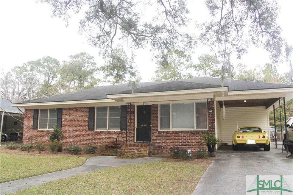 Brick home with one car carport.