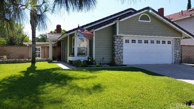 nicely landscaped front yard with porch