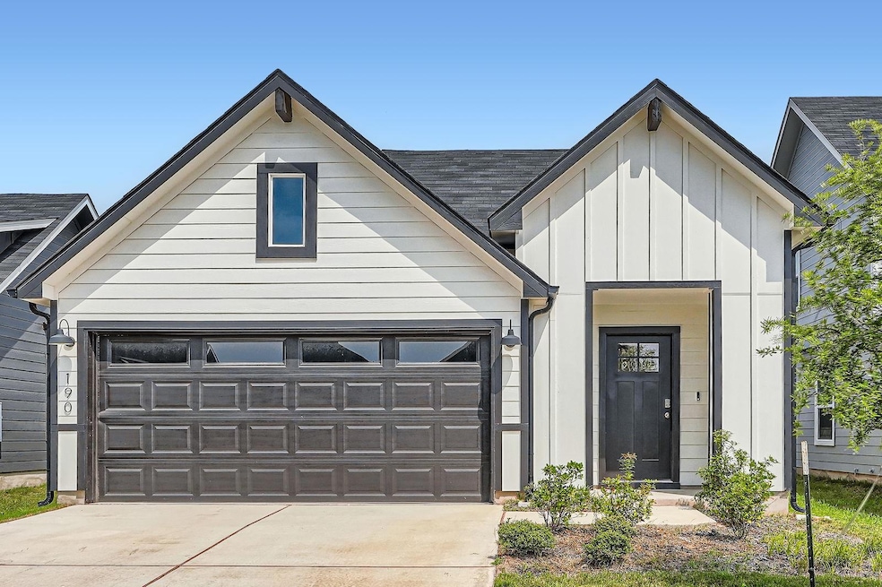 View of front of home with board and batten sidin