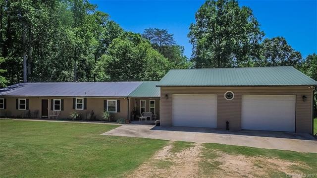 Front of home, attached garage, newer windows and 