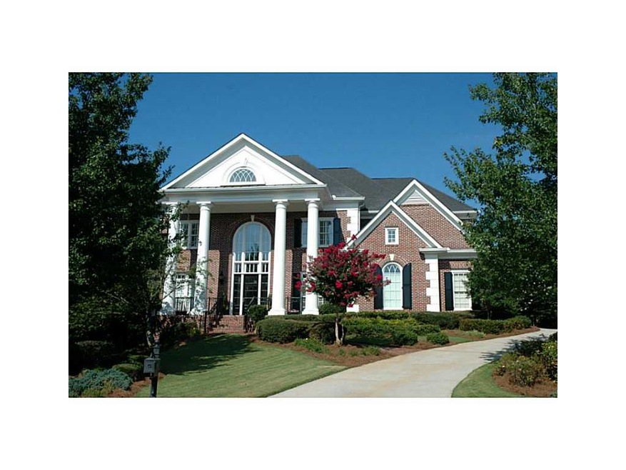 Exterior Front. Stately brick beauty on golf cours