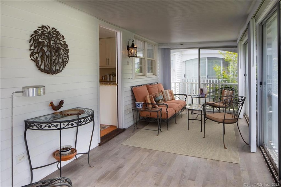 Sun porch with new flooring & view onto expansive 