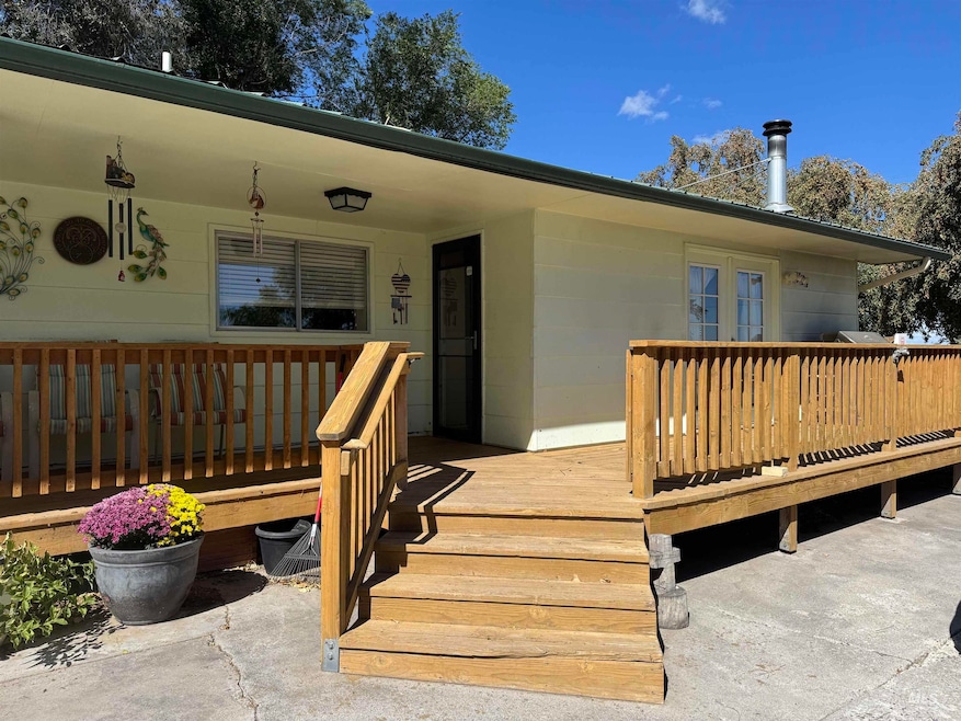 Property entrance with a wooden deck