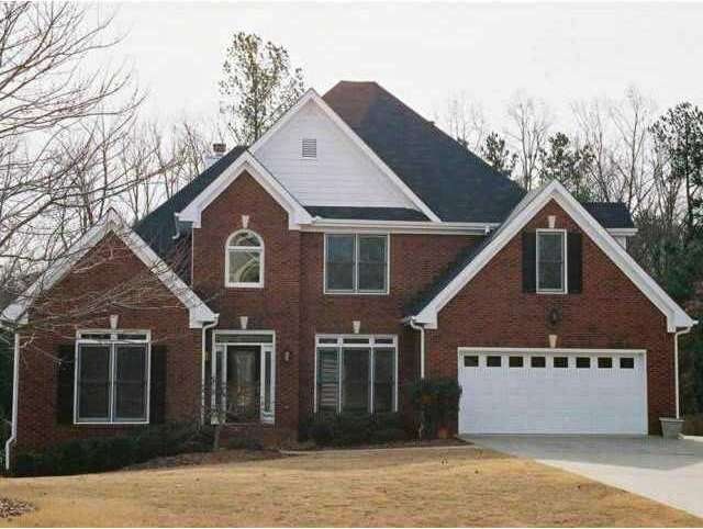 Exterior Front. Brick and Frame Two story with ful
