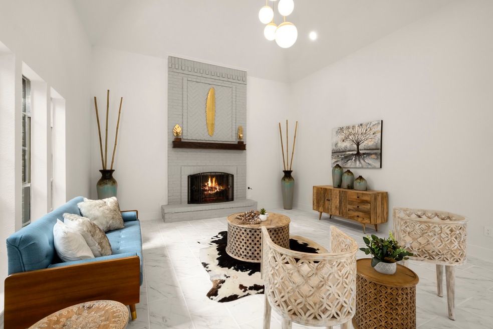 This grand living space has super tall ceilings and give that light and airy feel!