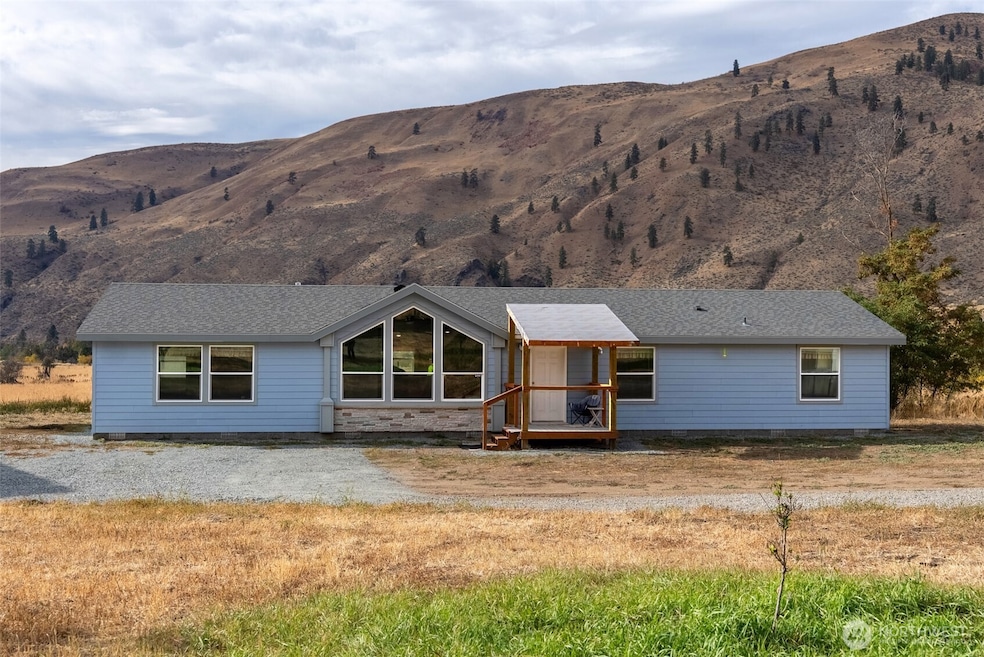Nearly new 2023 manufactured home with views from every room.