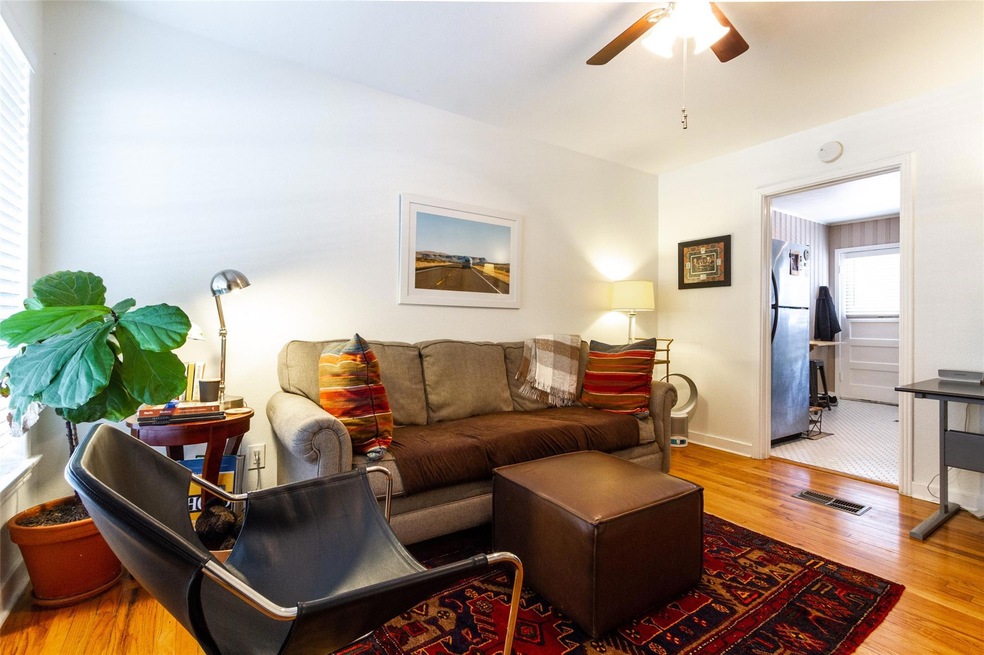 Living area featuring wood finished floors, ceili