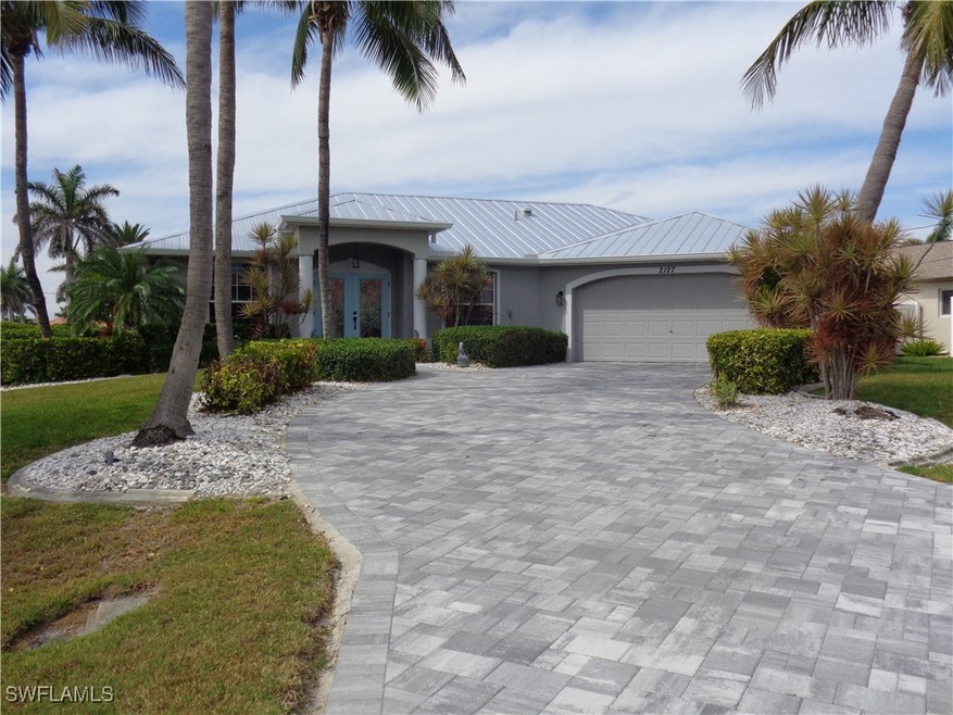 View of front of house with an attached garage, st